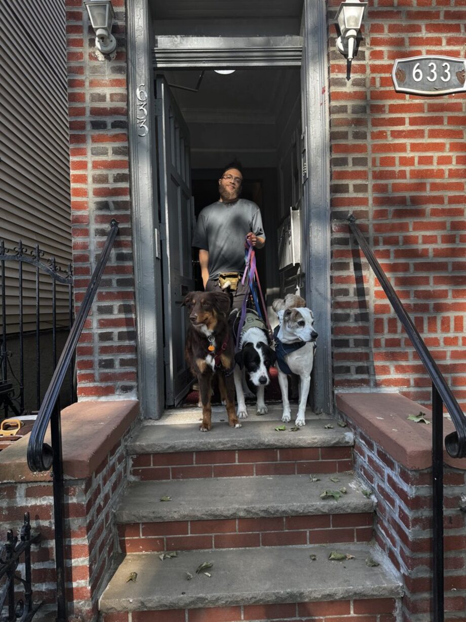 A PawNobi at the dojo's front door (633) with dogs ready for curbside drop-off